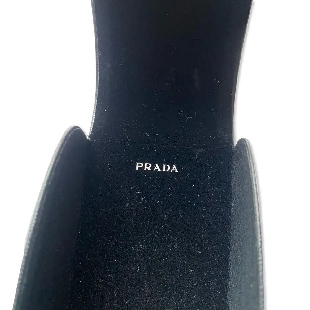 Prada Eyewear black square frame sunglasses logo sides Revolve in case $489